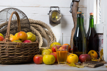 organic fresh apples with bottle of Normandy cider