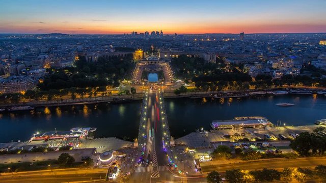 Aerial view over Trocadero day to night timelapse with the Palais de Chaillot seen from the Eiffel Tower in Paris, France.