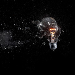 glass bulb explosion black background square format