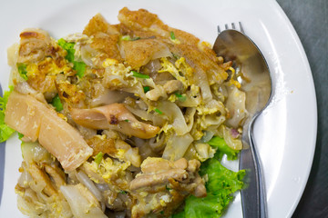 Stir fried flat noodle and chicken and egg Thai street food