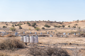 Dry Auob River cleared by burning invader shrubs for charcoal