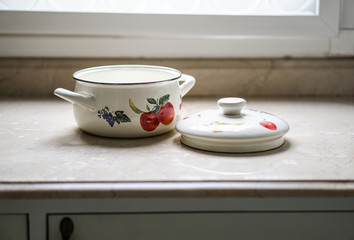 Fototapeta na wymiar Vintage cooking pot on the kitchen table