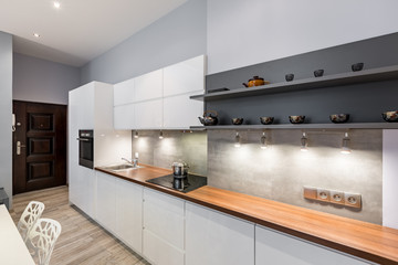 White kitchen with wooden countertop