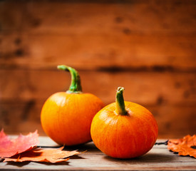 Autumn Pumpkin Happy Thanksgiving Background with  orange pumpkins on wooden table with copyspace.