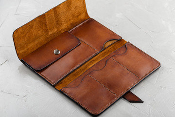 Handmade brown leather empty open wallet