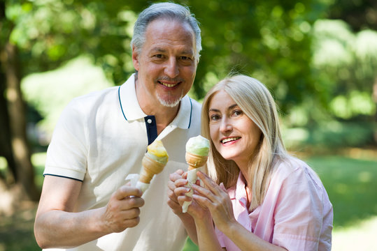 Happy Mature Couple Having An Ice Cream