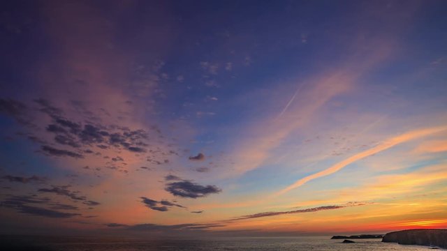 Clouds at sunrise on the coast of Spain, time-lapse
