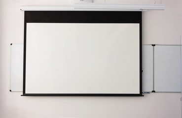 White board on the wall in classroom,