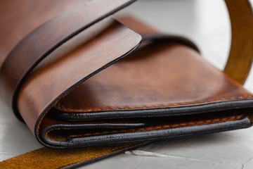 Closeup stylish handmade brown leather wallet