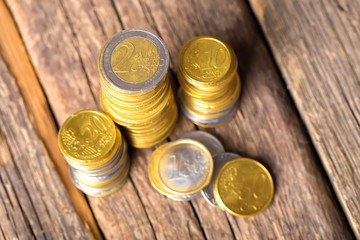 Euro coins in group on wooden background