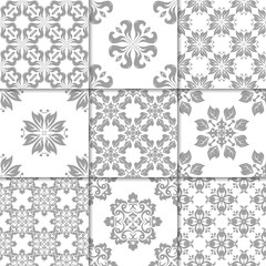Gray and white floral ornaments. Collection of seamless patterns