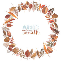 A wreath of different kinds of autumn leaves painted in watercolor.