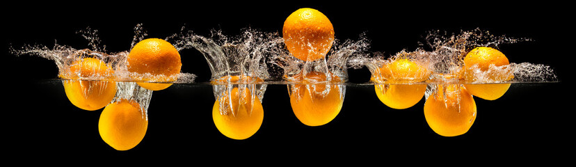 Group of fresh fruits falling in water