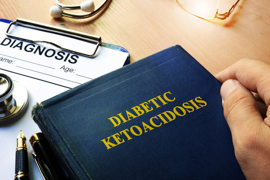 Diabetic Ketoacidosis Concept. Doctor Holding Book About Disorder.