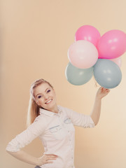 Fototapeta premium joyful girl playing with colorful balloons