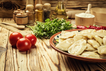 Vareniki (dumplings), pierogi - traditional Ukrainian food,Cooked and served vareniki,pyrohy or dumplings, filled with potato and served with salty caramelized onion,homemade