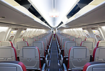 Rows of seats and aisle of a commercial airplane