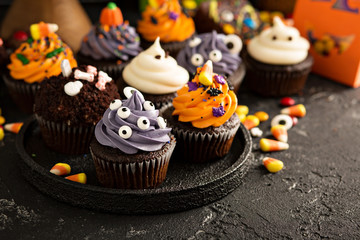 Fototapeta na wymiar Festive Halloween cupcakes and treats