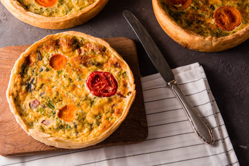 Pieces of quiche lorraine with bacon and cheese. French cuisine.