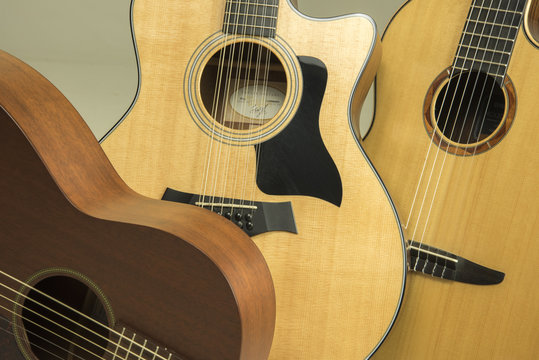 Six and twelve string upscale acoustic guitars