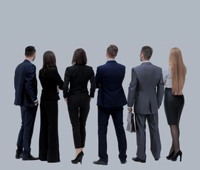 Business people from the back - looking at something over a whit