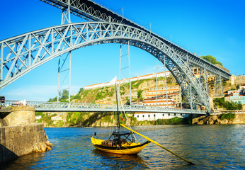 bridge of Dom Luis I at sunny day in old Porto, Portugal, retro toned