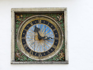 Fototapeta na wymiar Old wall medieval clock of the Holy Spirit Church, Tallinn, Estonia..