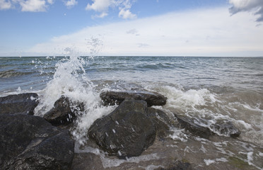 Waves hitting stones on the beach
