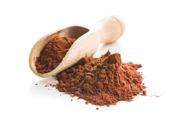 Tasty cocoa powder in wooden scoop.