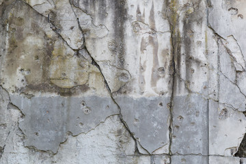 Old, damaged and cracked wall with real bullet holes from World War II in Gdansk, Poland. Background texture.