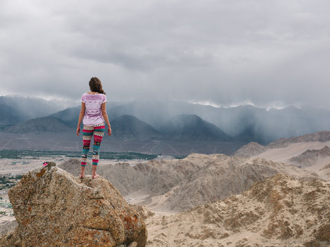 Adventure Girl Standing on the Top of Mountains