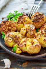 Potatoes baked with garlic,thyme and green parsley.