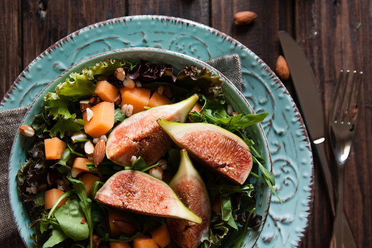 Delicious salad with cantaloupe melon and figs