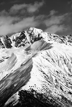 Fototapeta Black and white snow mountain peak at sunny day