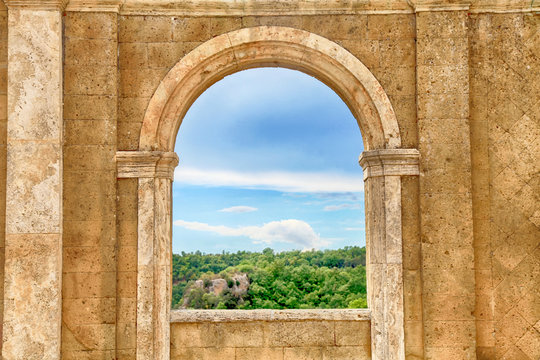 Italian view through the arch window, Tuscany, Italy