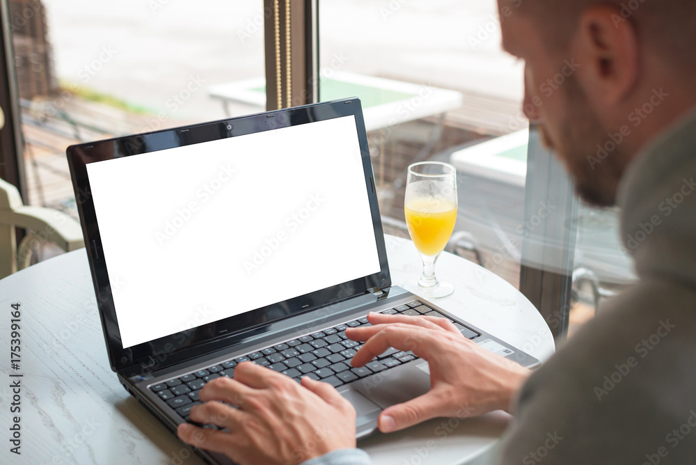 Aufkleber work on laptop computer in coffee shop. isolated screen for mockup.