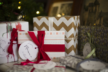 Close up of group of wrapped presents under the Christmas tree