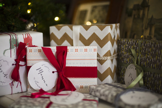 Close up of group of wrapped presents under the Christmas tree