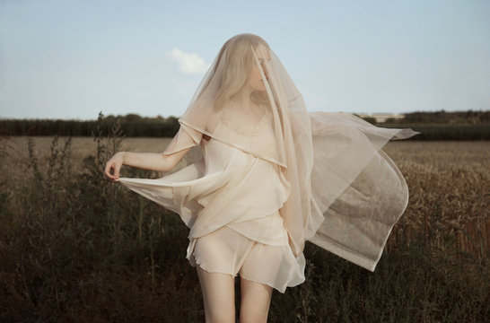 woman in transparent dress and veil outdoor