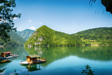 Naklejka premium Perucac, Serbia July 31, 2017: Houseboats of Perucac lake, Tara National Park (Serbia) 