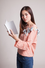 Young Asian woman with a book.