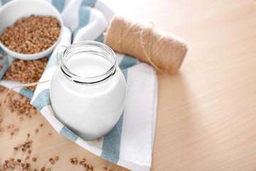Beautiful composition with hemp milk on table