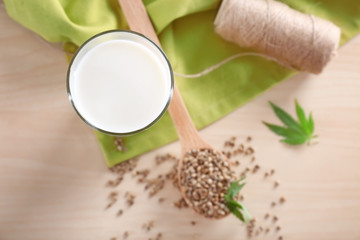 Glass with hemp milk on table