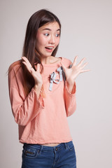 Young Asian woman is surprised and smile.