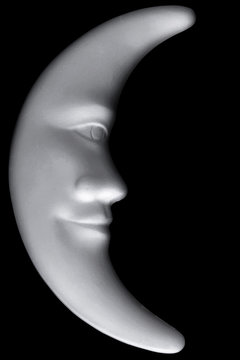 Lunar month, a figurine of white clay, isolated on black background