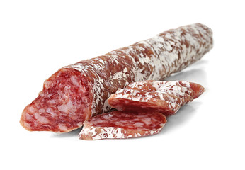 Delicious sliced sausage on white background