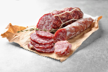 Delicious sliced sausages on table