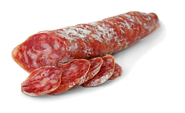Delicious sliced sausage on white background