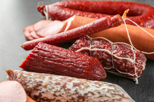 Assortment of delicious sausages on table
