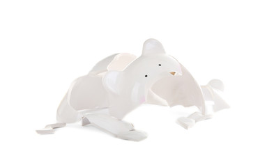 Broken piggy bank on white background